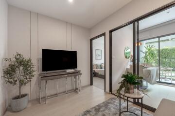 Modern living room with TV and indoor plants