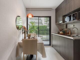 Modern kitchen with dining area and large window