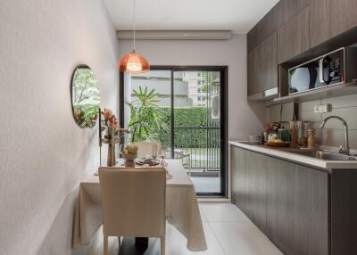 Modern kitchen with dining area and view of balcony