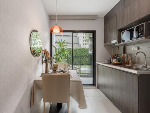 Modern kitchen with dining area and view of balcony