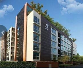 Modern apartment building with a unique design and large windows