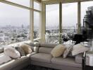 Spacious living room with large windows and city view