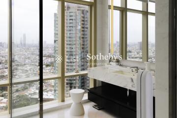 Modern bathroom with large windows and city view