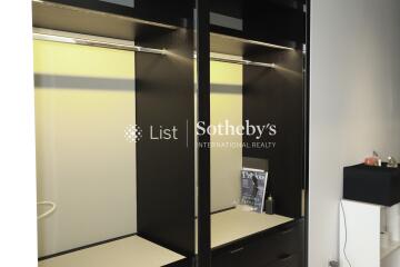 modern closet with hanging rods and shelving