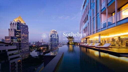 Modern high-rise building with a rooftop pool overlooking the city skyline