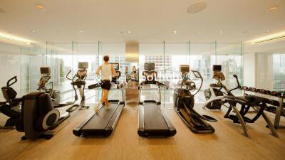 Modern exercise room with various gym equipment