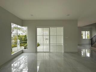 spacious modern living area with large windows