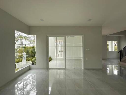 spacious modern living area with large windows