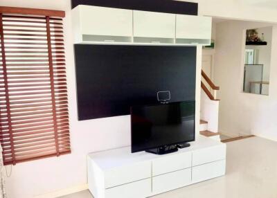 Modern living room with entertainment unit and television