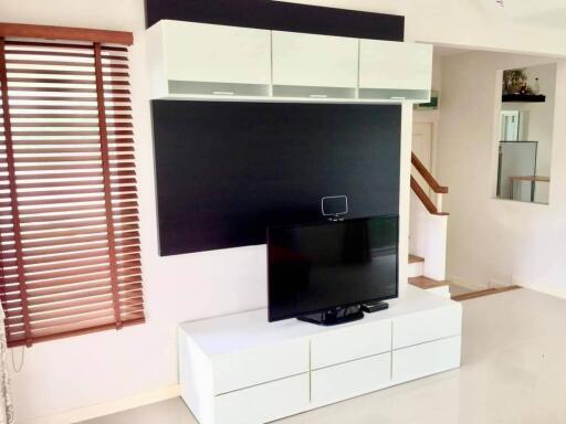 Modern living room with entertainment unit and television