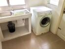 Laundry room with sink and washer