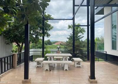 Covered outdoor dining area with picnic table