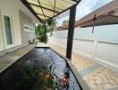 Covered outdoor area with fish pond