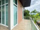 Spacious balcony with glass railing and scenic view