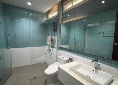 Modern bathroom with large mirror and glass shower