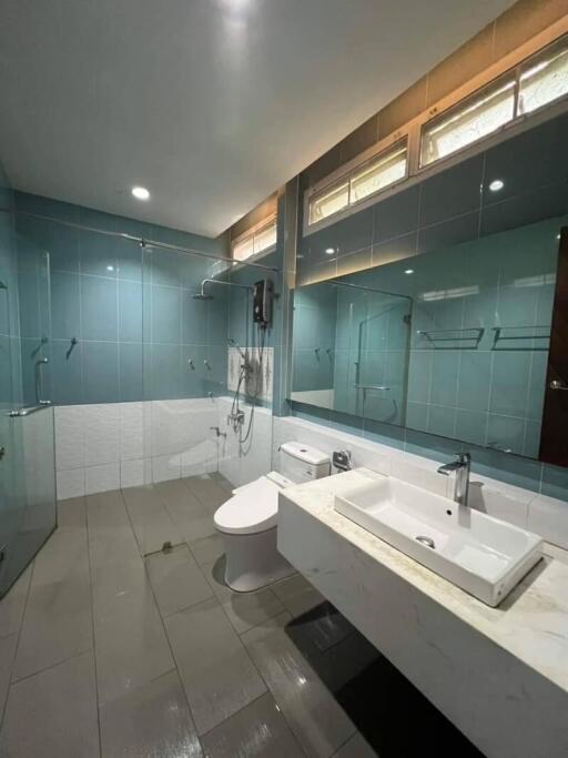 Modern bathroom with large mirror and glass shower