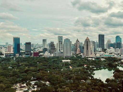 View of city skyline with park and greenery