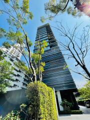 Tall modern building with trees in foreground