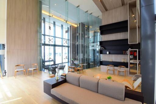 Modern living space with large windows and contemporary furnishings