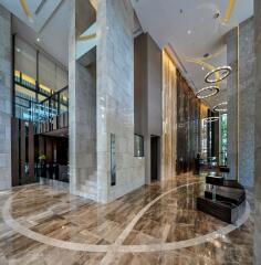 Modern building lobby with marble floors and stylish lighting