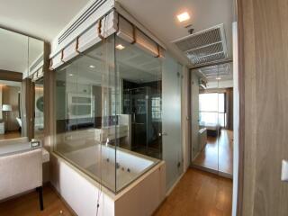 Modern bathroom with glass-enclosed shower and bathtub