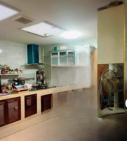 Modern kitchen with open shelving and cooking appliances