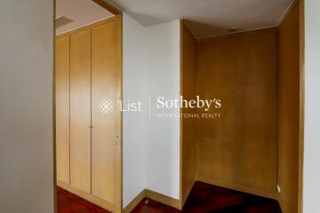 A simple hallway with wooden cabinets