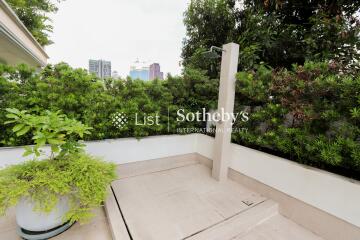 Rooftop patio with greenery