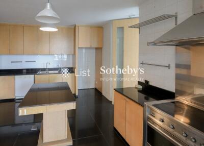 Modern kitchen with stainless steel appliances and wooden cabinetry