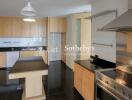 Modern kitchen with stainless steel appliances and wooden cabinetry