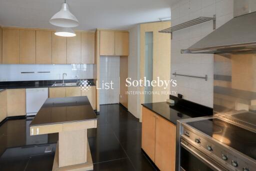 Modern kitchen with stainless steel appliances and wooden cabinetry