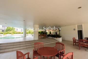 Outdoor seating area near swimming pool