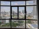 View through large windows showing a cityscape