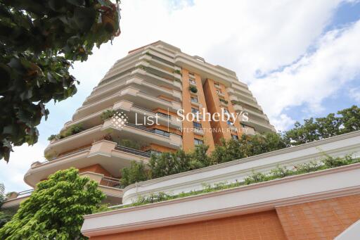 View of a tall building with multiple balconies