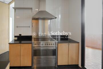 Modern stainless steel kitchen with wooden cabinets