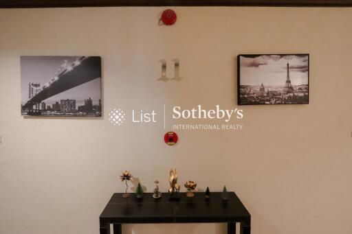 Hallway with wall decor and a small table