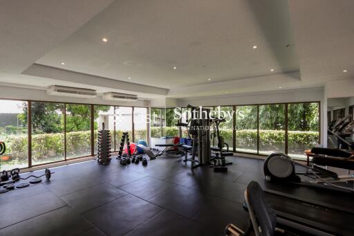 Spacious and well-equipped gym with modern fitness equipment and large windows