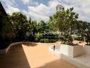 Spacious outdoor garden with pathways and greenery