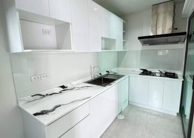 Modern white kitchen with marble countertops