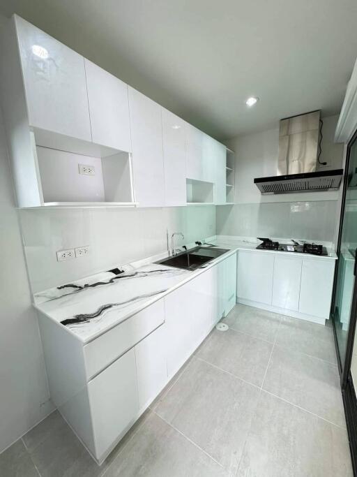 Modern white kitchen with marble countertops