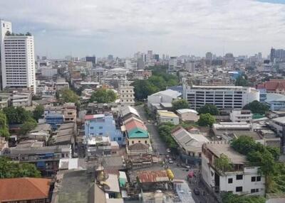 Aerial view of a city with buildings and greenery