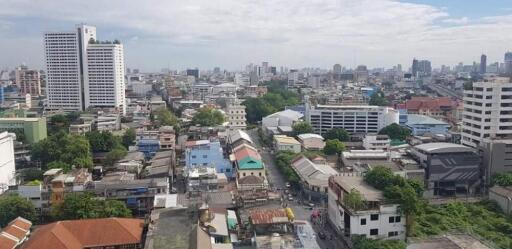 Aerial view of a city with buildings and greenery