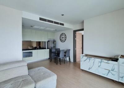 Modern living area with connected kitchen and furniture