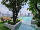 Outdoor pool area with city skyline view