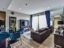 Modern living room with dining area and large TV