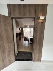 Entrance to a modern apartment with a view of the living room area