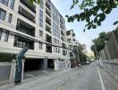 Street view of a modern multi-story apartment building