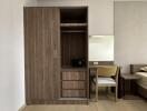 bedroom with wooden wardrobe and study area