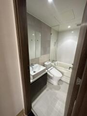 Modern bathroom with sink, toilet, and bathtub