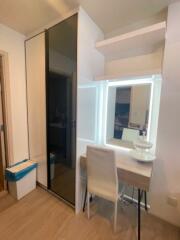 Modern bedroom with vanity desk and large sliding-door closet